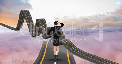 Digitally generated image of  businesswoman on wavy road in sky
