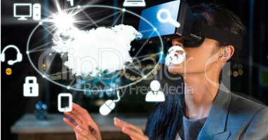 Digital composite image of businesswoman looking at map and icons through VR glasses