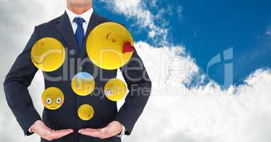 Midsection of businessman with various emojis
