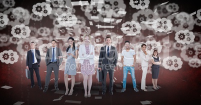 Digitally generated image of business people standing with gears flying in background