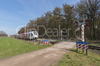 Unguarded railroad crossing.