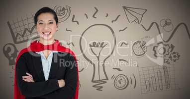 Business woman superhero with arms folded against brown background with idea doodles