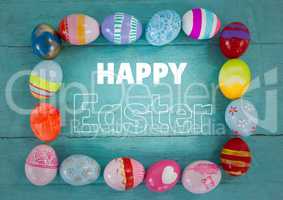 White type surrounded by easter eggs on teal table