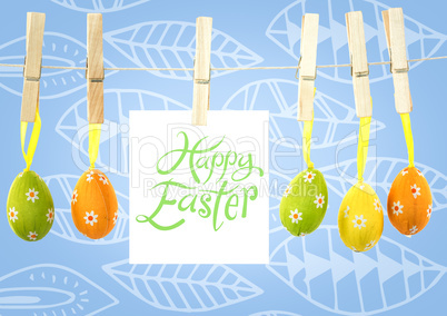 Happy Easter text with Easter Eggs on pegs with note in front of pattern