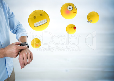 Business man mid section with watch and emojis with flare against blurry grey wood panel
