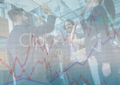 Business team high fiving and chart graphic overlay