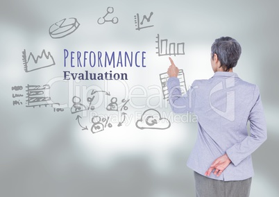 Businesswoman touching Performance Evaluation text with drawings graphics