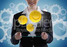 Business woman with glass device and emojis with flare against blue background with gears