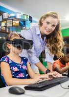 Giril with teacher wearing VR Virtual Reality Headset with Interface