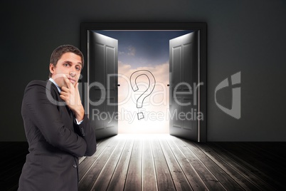 Confused businessman standing with door and question mark sign in background