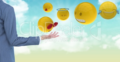 Cropped image of business person standing by various emojis