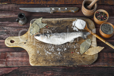 Fresh smelt fish  on the kitchen cutting board