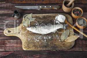 Fresh smelt fish  on the kitchen cutting board