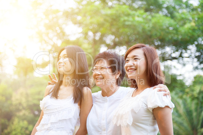 Asian mother and grown daughters