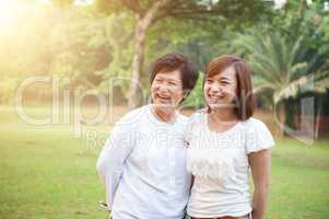 Asian elderly mother and grown daughter