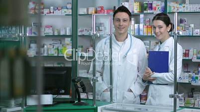 Portrait of experienced pharmacists team smiling