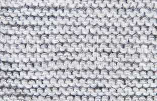 Background large knitted woolen threads of gray