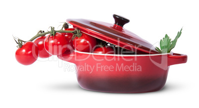 Cherry tomatoes and parsley in saucepan with lid