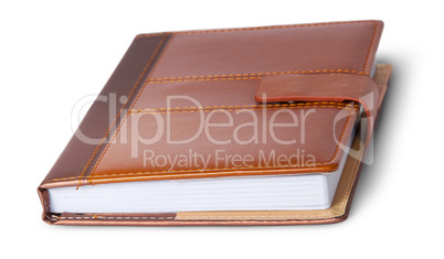 Closed notebook in leather cover rotated