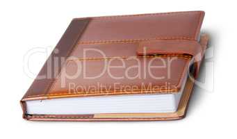Closed notebook in leather cover rotated