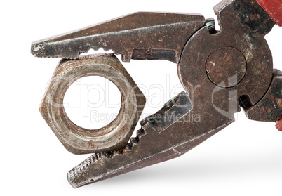 Closeup of old pliers and nut