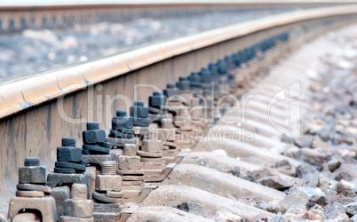 Closeup of rails and sleepers leaving afar