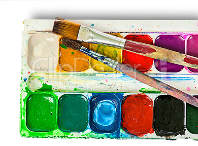 Closeup of watercolor paints set and brushes