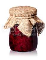 Currant jam in jar with burlap