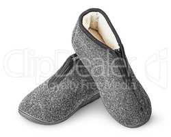 Dark gray slippers with fur one on another