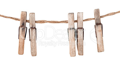 Five old clothespins on rope