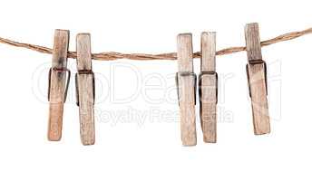 Five old clothespins on rope
