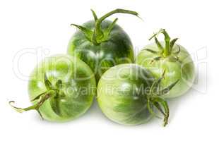 Four green tomatoes near