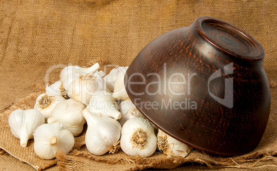 Garlic spill out of a ceramic bowl