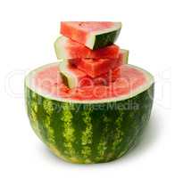 Half of watermelon and slices on top