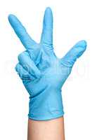Hand in blue latex glove showing three fingers vertically