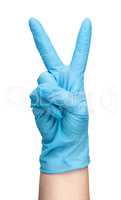 Hand in blue latex glove showing two fingers