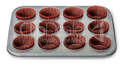 In front cupcake and muffin pan with paper cups