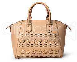 In front elegant women beige handbag