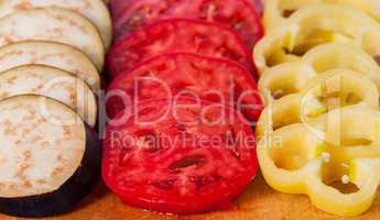 In front sliced eggplant tomato and sweet pepper