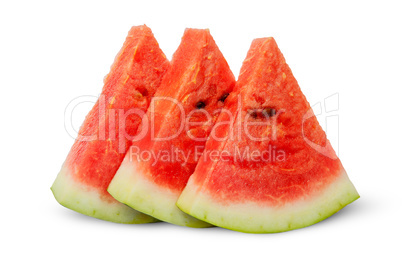 In front threel slices of watermelon stacked ladder