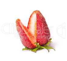 Juicy ripe strawberries with a cut segment