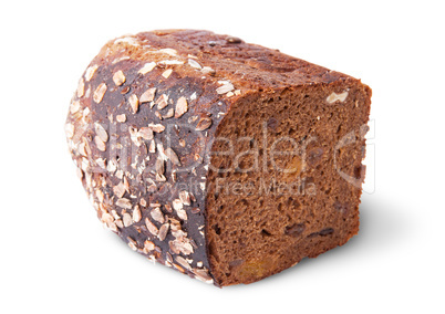 Lying half unleavened black bread with seeds and dried fruit