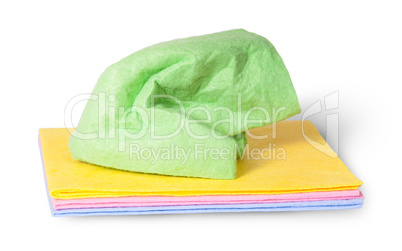 Multicolored cleaning cloths crumpled on top