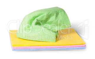 Multicolored cleaning cloths crumpled on top