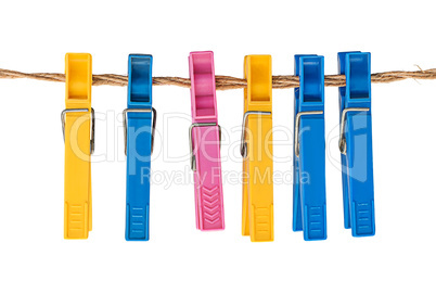 Multicolored plastic clothespins on a rope