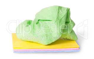 Multicolored stack cleaning cloths crumpled on top