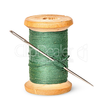 Needle and thread on wooden spool vertically