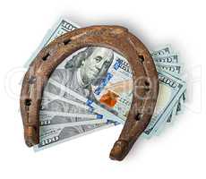 Old rusty horseshoe and money