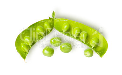 Opened green pea pod and several peas