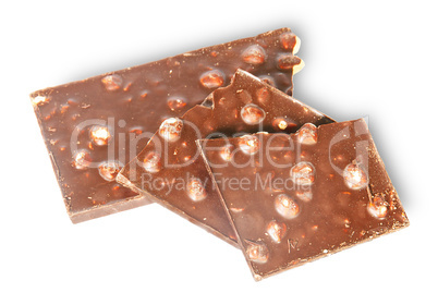 Pieces of dark chocolate with hazelnuts